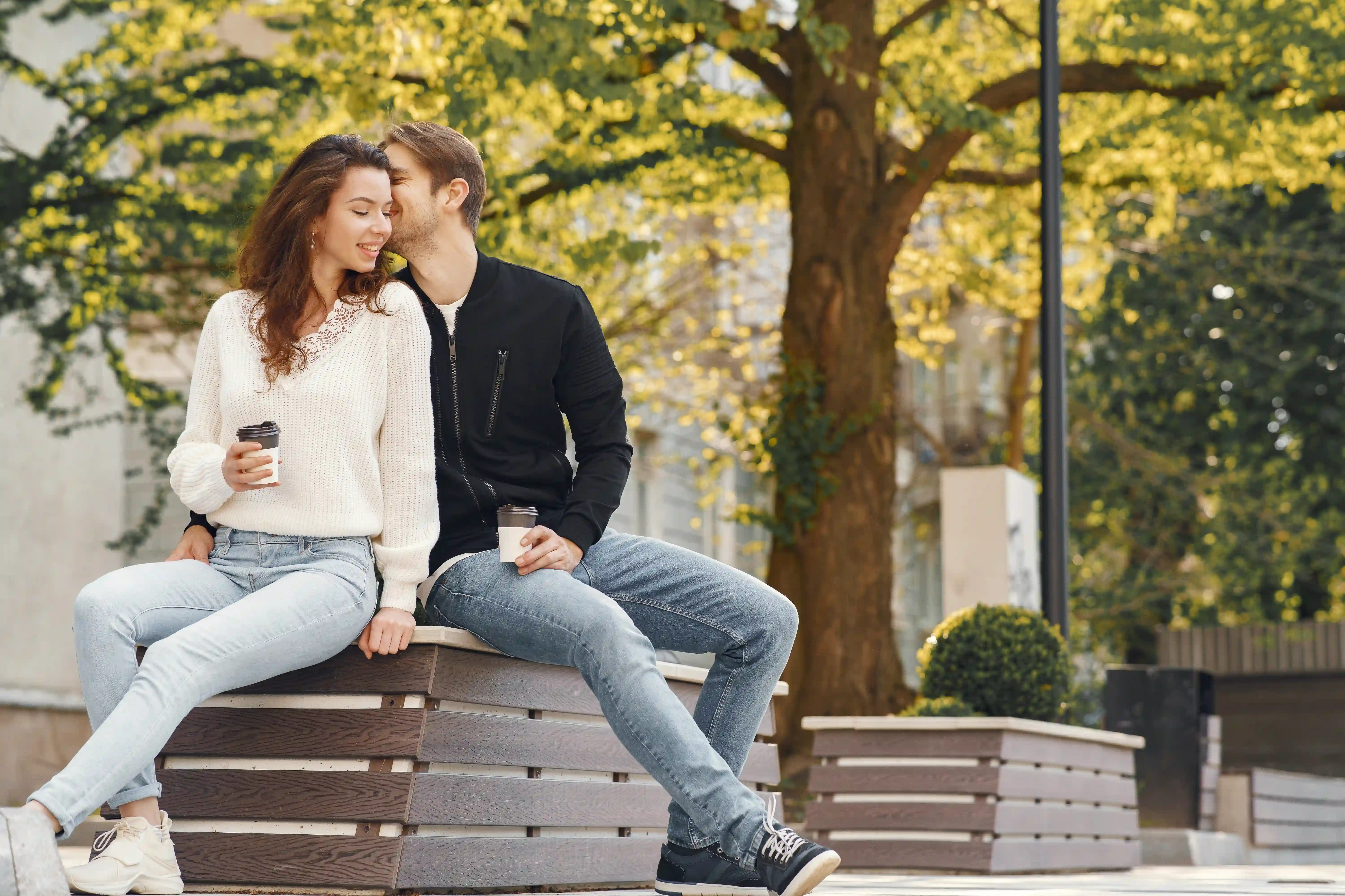 Couple sitting on wooden bench